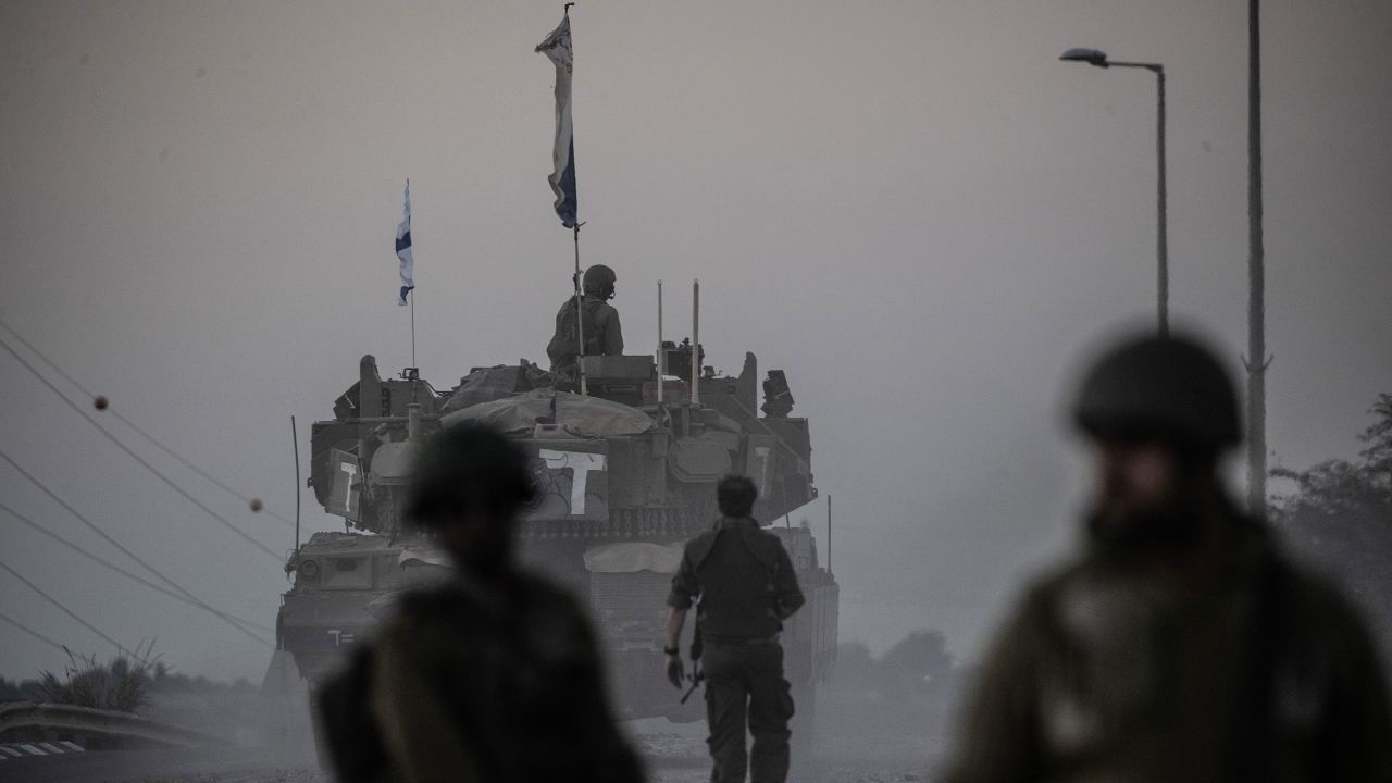 Israeli tanks move near Gaza border as Israeli army deploys military vehicles around the Gaza Strip, Israel on October 12, 2023.