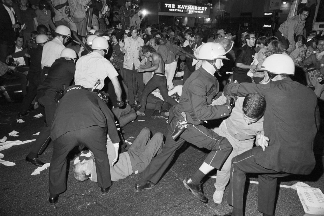 In this August 1968 photo, police and demonstrators clash near the Conrad Hilton Hotel during the Democratic National Convention in Chicago.